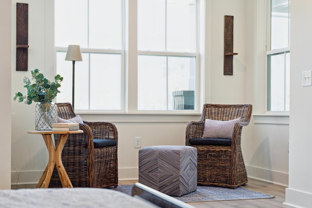 living area with hardwood / wood-style flooring