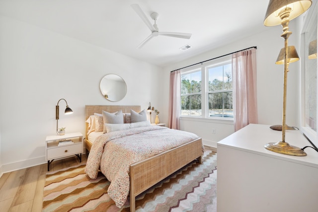 bedroom with hardwood / wood-style flooring and ceiling fan