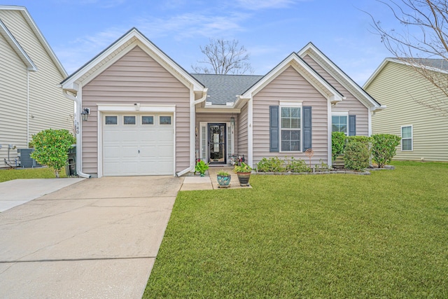 ranch-style house featuring a garage, a front lawn, and driveway