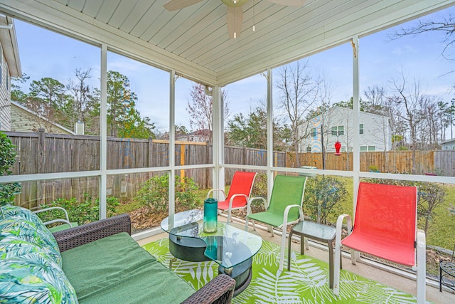 sunroom featuring ceiling fan