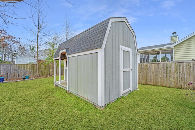 view of shed featuring a fenced backyard