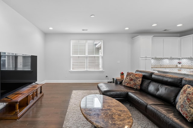 living room featuring dark hardwood / wood-style flooring