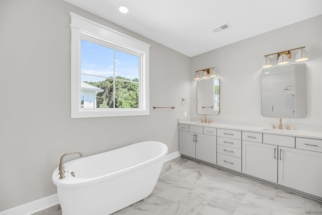 1056 Capersview Ct, Awendaw, SC 29429 - full bathroom featuring marble finish flooring, double vanity, a freestanding tub, and recessed lighting
