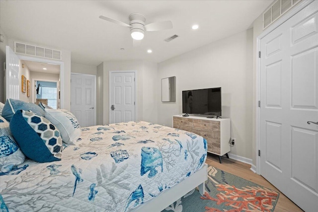 bedroom featuring ceiling fan and light hardwood / wood-style floors