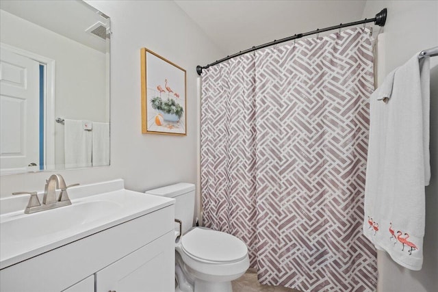 bathroom with toilet and vanity