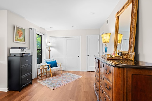 living area with light hardwood / wood-style floors