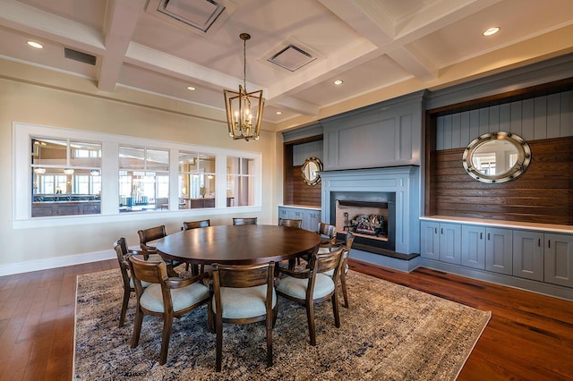 dining space with a chandelier, beam ceiling, dark hardwood / wood-style flooring, and coffered ceiling