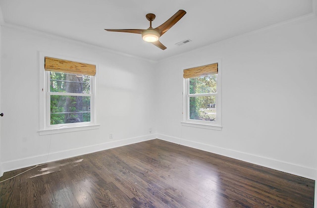 unfurnished room featuring a ceiling fan, dark wood-type flooring, and crown molding