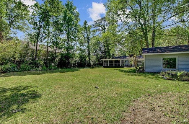 view of yard featuring a sunroom