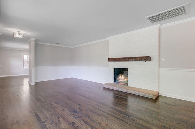 unfurnished living room featuring a fireplace, wood finished floors, visible vents, and ornamental molding