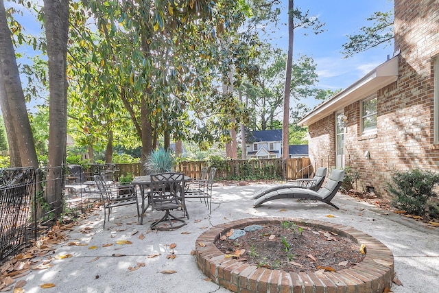 view of patio with a fenced backyard and outdoor dining space