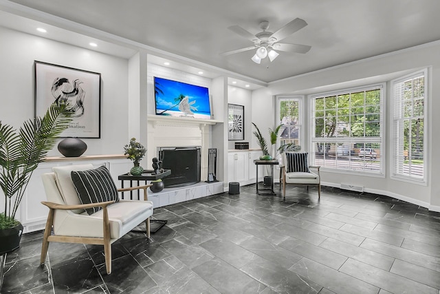 sitting room with ceiling fan, visible vents, a tile fireplace, baseboards, and recessed lighting
