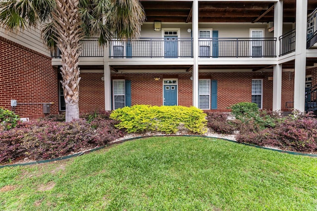 202 Trillium Ct, Santee, SC 29142 - property entrance with a lawn and brick siding