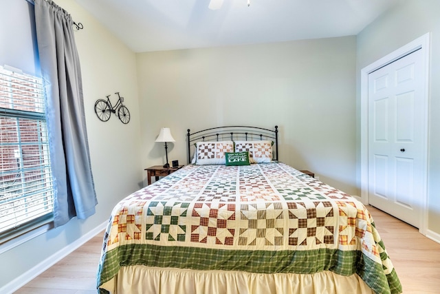202 Trillium Ct, Santee, SC 29142 - bedroom featuring multiple windows, light wood-style flooring, baseboards, and ceiling fan