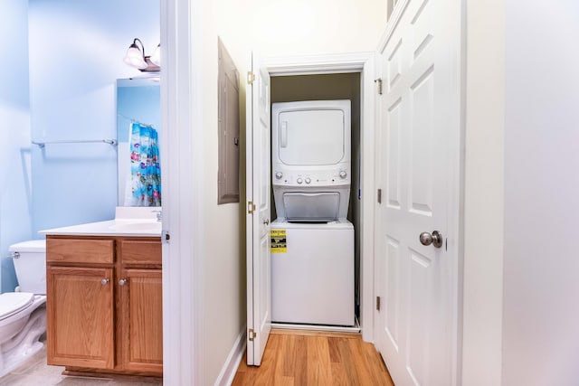 202 Trillium Ct, Santee, SC 29142 - washroom featuring estacked washer and dryer and light wood-type flooring