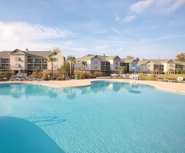 202 Trillium Ct, Santee, SC 29142 - community pool with a residential view and a patio