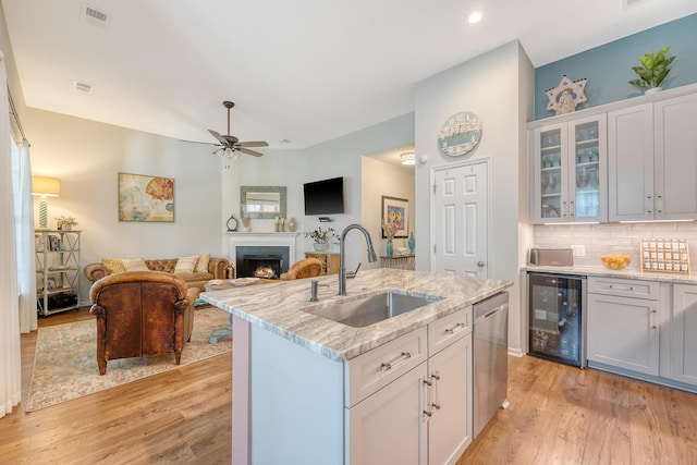 422 Cabrill Dr, Charleston, SC 29414 - kitchen featuring a sink, beverage cooler, stainless steel dishwasher, light wood-type flooring, and open floor plan