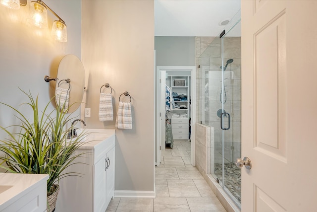 422 Cabrill Dr, Charleston, SC 29414 - full bathroom with vanity, a shower stall, a spacious closet, and baseboards