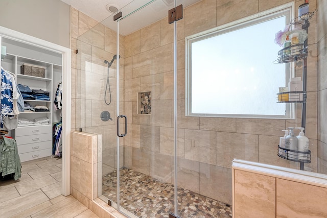 422 Cabrill Dr, Charleston, SC 29414 - bathroom featuring a stall shower, a spacious closet, and tile patterned floors