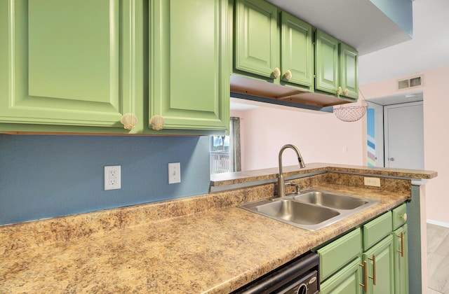 kitchen with a sink, visible vents, dishwasher, and light countertops