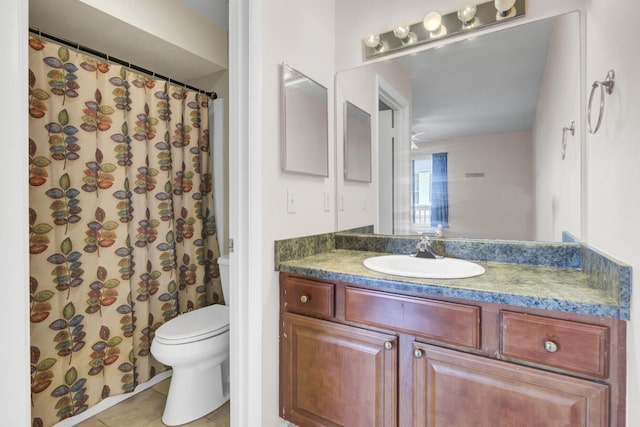 full bath featuring vanity, tile patterned floors, and toilet