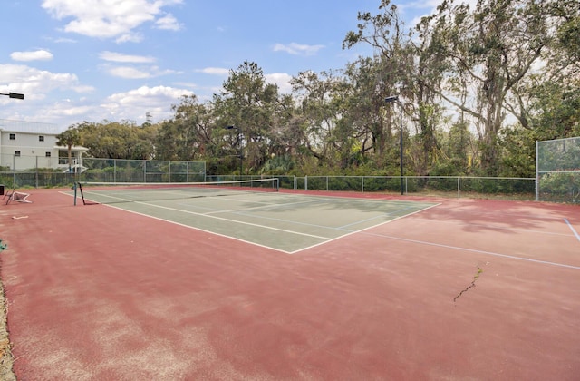 view of sport court with community basketball court and fence