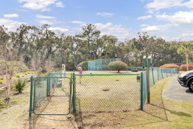 view of gate featuring fence