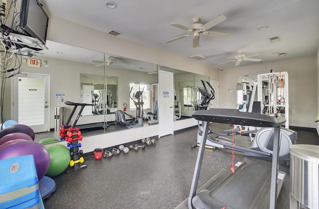 gym featuring visible vents and ceiling fan