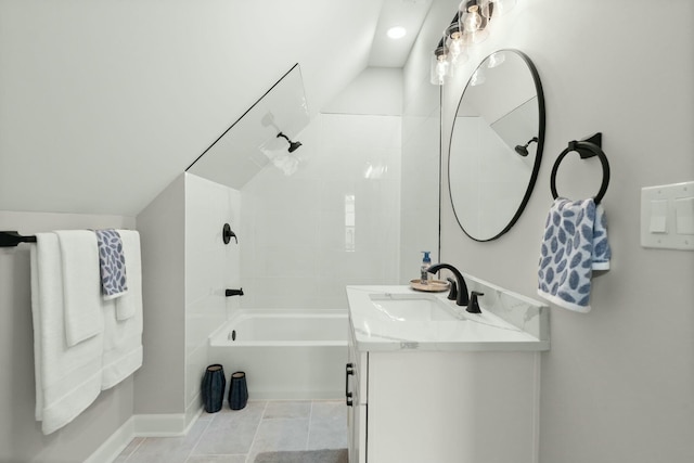 full bathroom with lofted ceiling, washtub / shower combination, and vanity