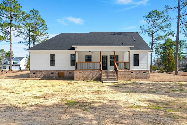 rear view of property featuring a ceiling fan, crawl space, and covered porch