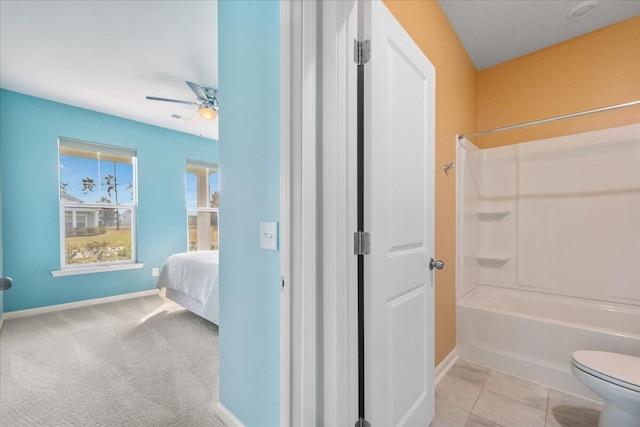 bathroom featuring tile patterned floors, toilet, ceiling fan, and tub / shower combination