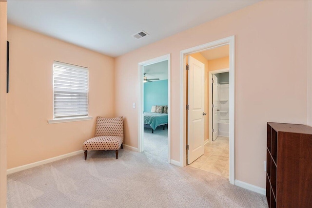 living area with light carpet