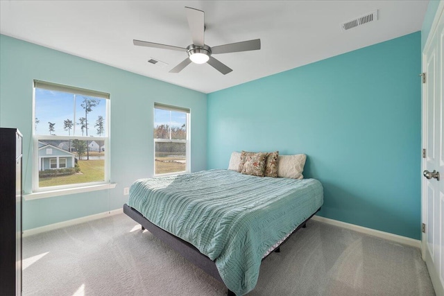 carpeted bedroom with ceiling fan