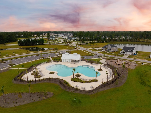 aerial view at dusk with a water view