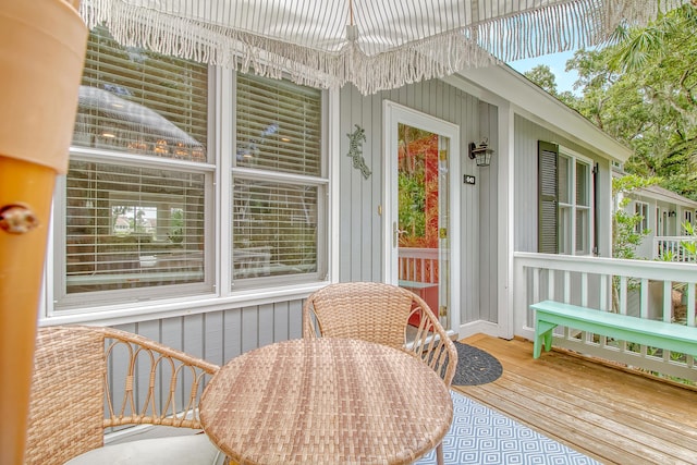 sunroom featuring a notable chandelier