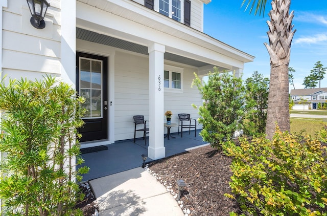 property entrance featuring covered porch