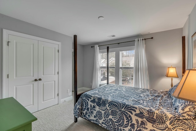 carpeted bedroom with a closet