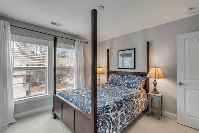 bedroom featuring light colored carpet