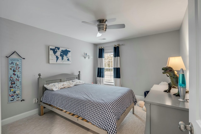 bedroom with ceiling fan and light colored carpet