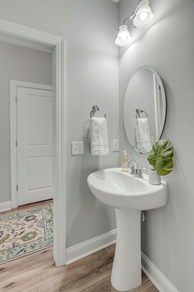 bathroom featuring sink and hardwood / wood-style flooring