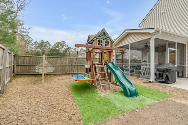 view of play area featuring a sunroom and ceiling fan