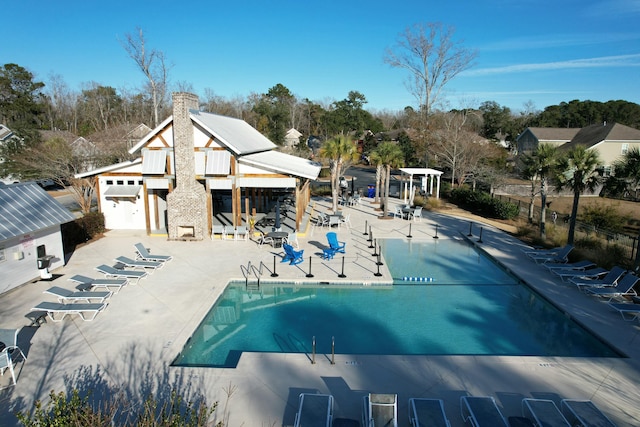 view of pool featuring a patio