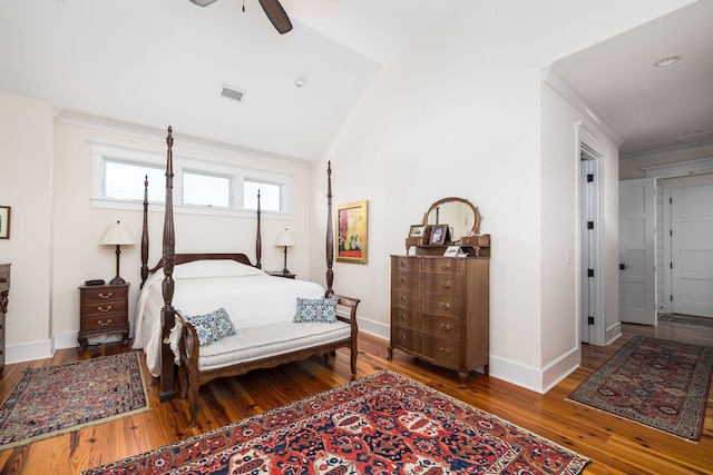 bedroom with vaulted ceiling, hardwood / wood-style flooring, and ceiling fan