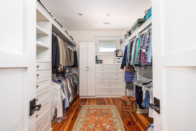 spacious closet with dark wood-type flooring