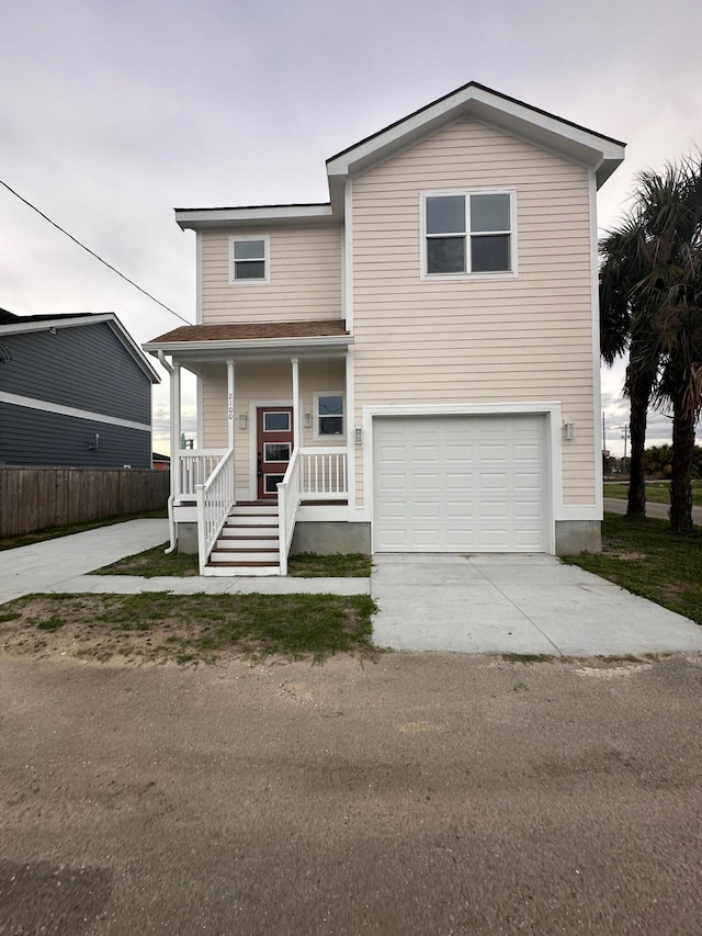 2100 Booker St, Charleston, SC 29405 - view of front of house featuring driveway, an attached garage, and a porch
