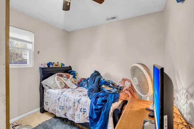 bedroom featuring carpet floors, baseboards, visible vents, and a ceiling fan