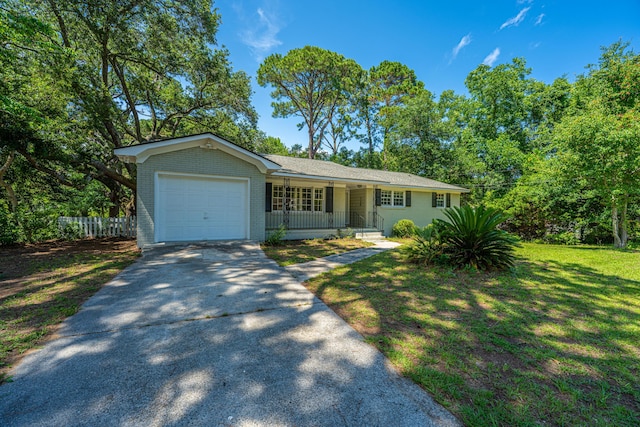 734 Waterloo St, Charleston, SC 29412 - single story home with a garage, concrete driveway, a porch, and brick siding
