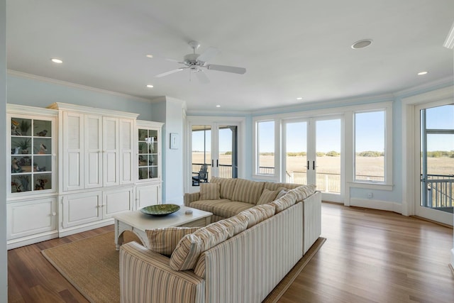 living room featuring crown molding, recessed lighting, french doors, wood finished floors, and a ceiling fan