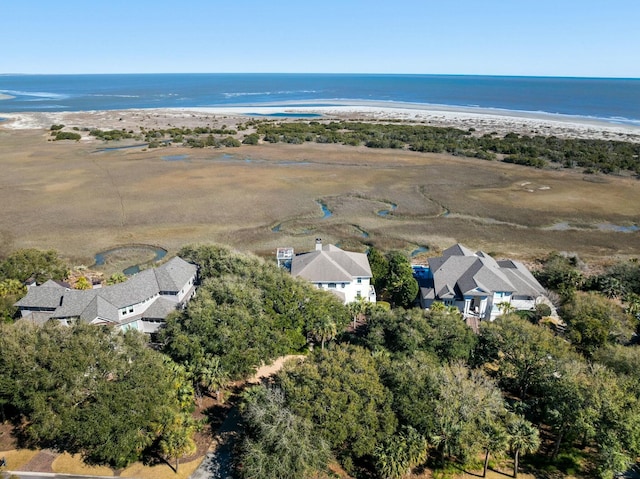 drone / aerial view featuring a beach view and a water view