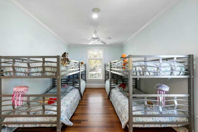 bedroom featuring crown molding and wood finished floors